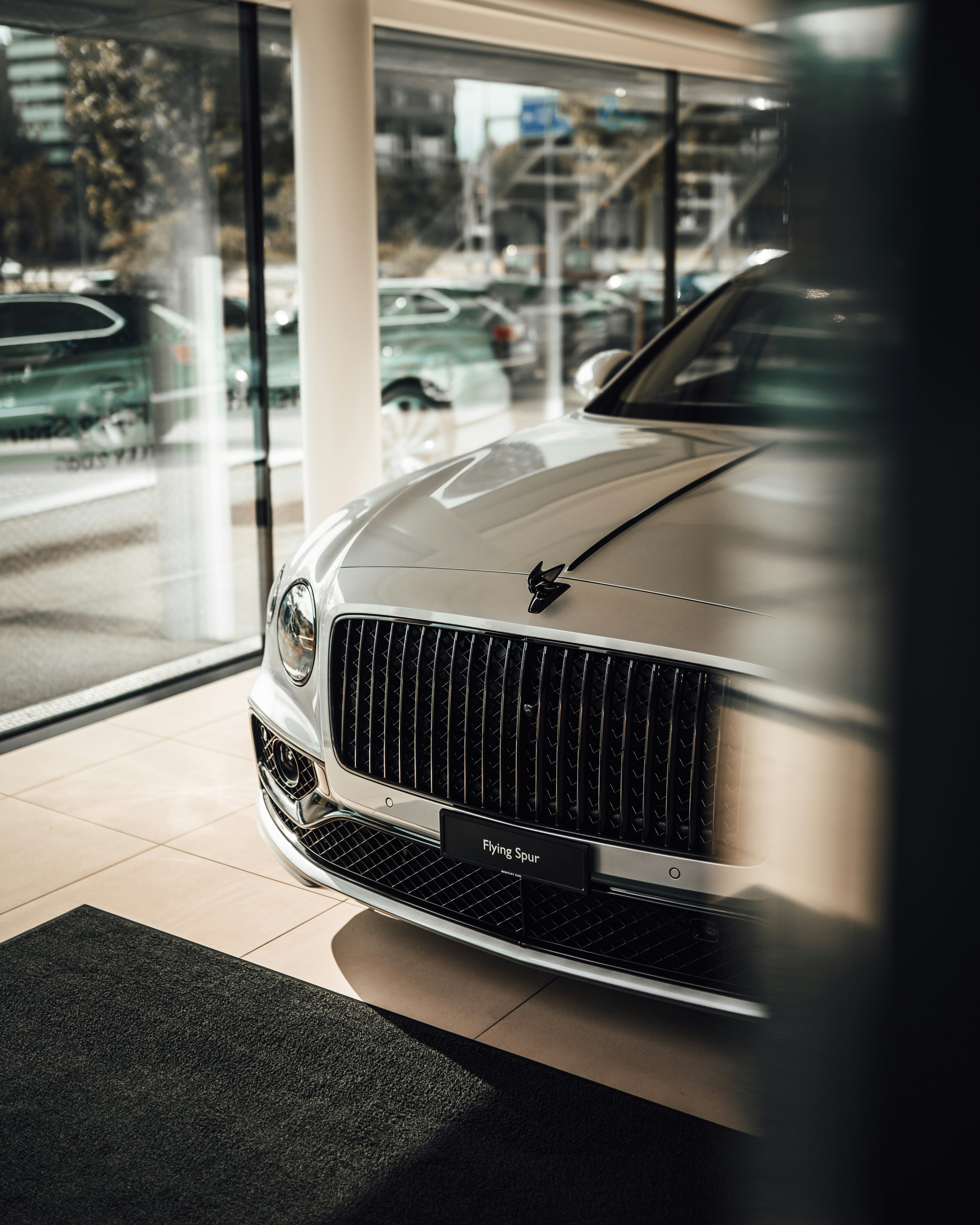 silver mercedes benz car in a building